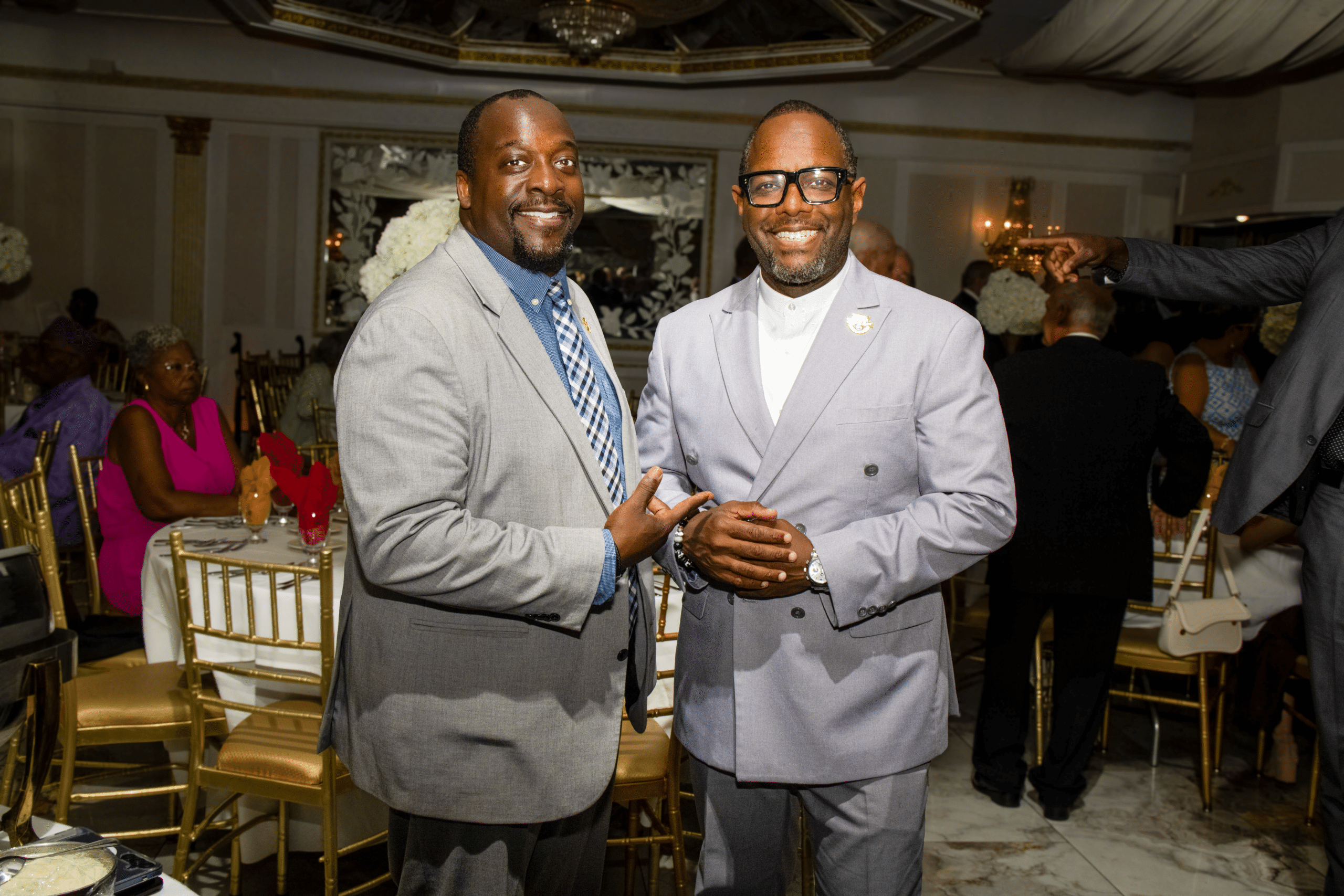 A member of the security detail, left, with Union County Commissioner and EAHOF Board Member Stan Neron, right.