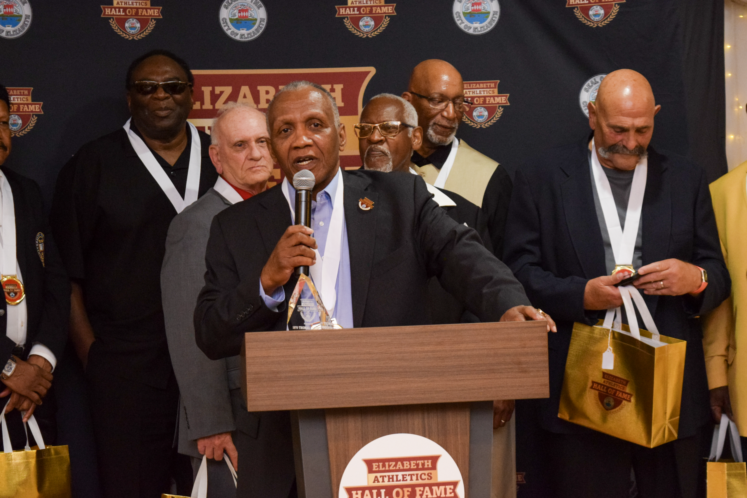 Gil Chapman speaks on behalf of the 1970 Thomas Jefferson High School Football Team during the team’s induction.
