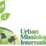 Urban Missiology International logo redesigned by Remeoner, with green UMI leaves above a globe of human profiles